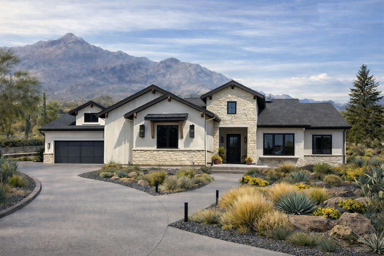 Sedona II Elevation C ranch home front exterior with stone, stucco, and a mountain backdrop
